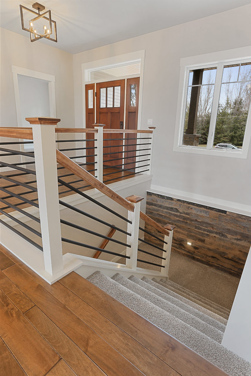 Metal railing staircase and foyer